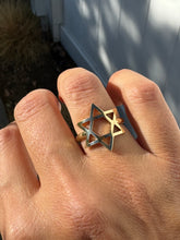 Load image into Gallery viewer, Willow Roe 14K gold Star of David ring on a floor background with white fence.