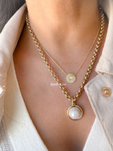Load image into Gallery viewer, Close up of Willow Roe 14K Gold layered necklaces featuring gold Pleated diamond disc pendant and a bold link chain with large pearl pendant on model